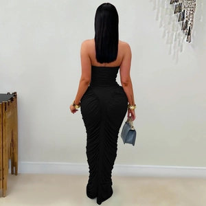 Detail view of the elegant ruched back design on this black strapless bodycon maxi dress