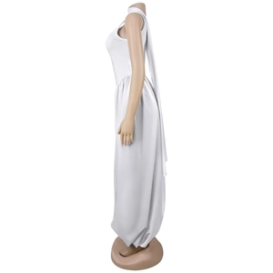 Side view of white halter neck jumpsuit featuring a long streamer and flowy wide-leg design