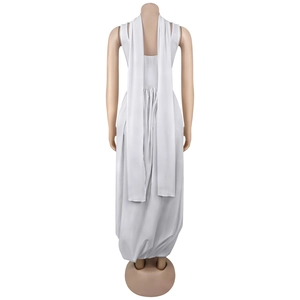 Detail view of the white sleeveless long dress with flowing back ribbon streamers