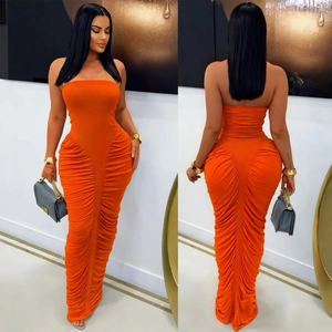 Detail showing bright orange tube long dress with elegant side and back ruching