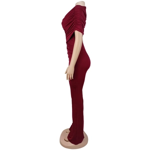 Detail of burgundy ruched off-shoulder neckline and slim fit bodice on jumpsuit