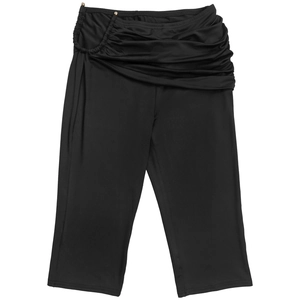 Detail of black slim fit cropped pants featuring waist pleats and gold metal accents