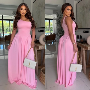 Detail view of pink one-shoulder maxi dress with elegant waist pleats and draped skirt