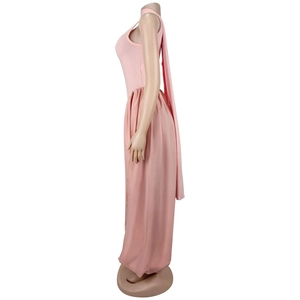 Detail view of light pink halter jumpsuit featuring long decorative streamers on the back