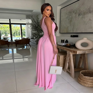 Detailed view of the elegant pink halter dress featuring artistic pleated draping design
