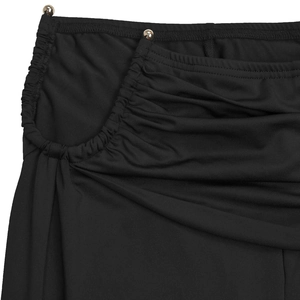 Close-up of ruched black silk fabric with silver bead embellishments on the waistline