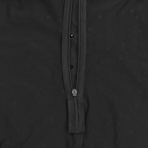 Detailed close-up of a high-quality metal zipper on an elegant black evening dress