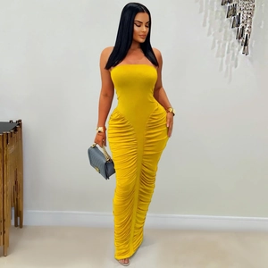 Detail view of the elegant yellow ruched tube dress with slimming bodycon fit and long hem