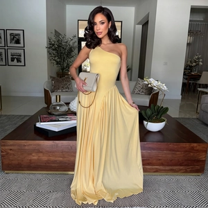 Detail of elegant pale yellow one-shoulder maxi dress with pleated waist and draped fabric