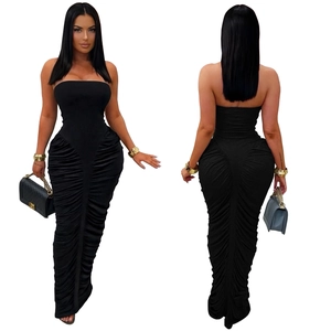Macro view of ruched fabric texture and bodycon fit on this elegant black tube maxi dress