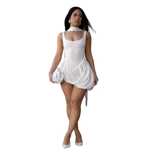 Detail of white mini dress with ruffled hemline and matching scarf accessory
