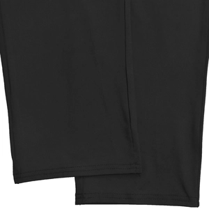 Detail shot of black trousers leg opening featuring professional double-needle stitching
