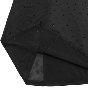Close-up of black mesh dress detailing layered fabric with sparkling rhinestones