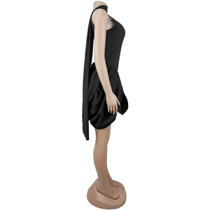 Detail view of black sleeveless bubble dress with long decorative shoulder ribbon