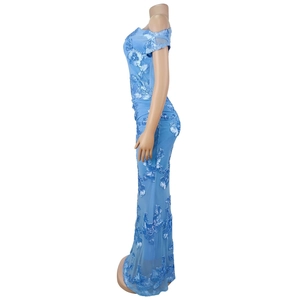Detail of sky blue evening gown with 3D floral lace appliqués on mesh fabric
