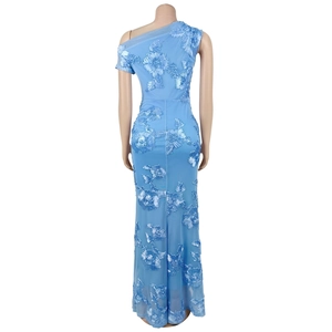 Detail of light blue one-shoulder dress featuring 3D floral embroidery and mesh texture
