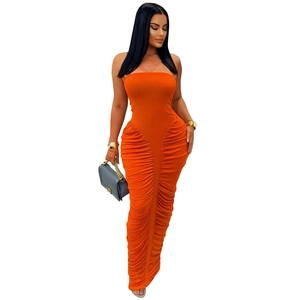 Detail of orange strapless bodycon maxi dress featuring all-over ruched texture fabric