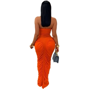 Back view of orange ruched strapless bodycon maxi dress showing pleated fabric detail