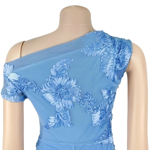 Detail of light blue mesh dress with 3D floral embroidery and one-shoulder design