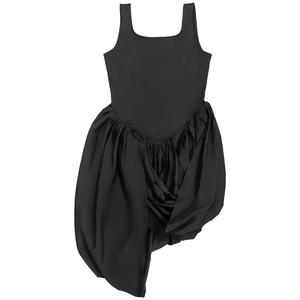 Detail view of black sleeveless dress showing asymmetric ruched hem and tiered ruffles