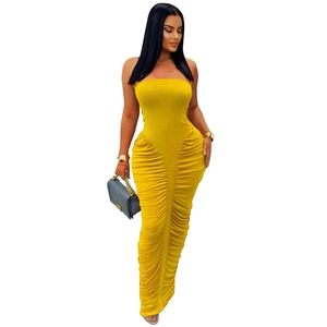 Detailed side view showing ruched texture and gathered fabric on yellow bodycon dress
