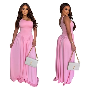 Detail of elegant pink one-shoulder maxi dress with high waist and pleated skirt