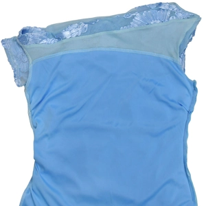 Detail of light blue mesh stitching and 3D lace floral trim on elegant women dress