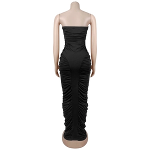 Close-up of ruched texture and slimming fabric on the back of a black tube maxi dress