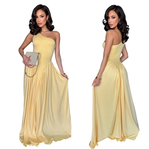 Detail of light yellow one-shoulder dress featuring pleated waist and flowing skirt