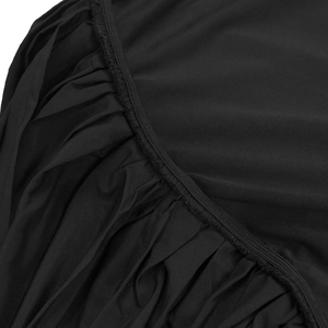 Detail of the elastic waistband with precise stitching and gathered fabric on black dress