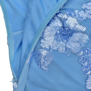 Detail of elegant sky blue dress with floral embroidery and invisible zipper on mesh fabric