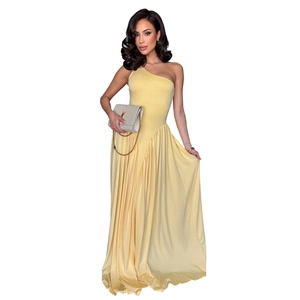 Detail of elegant pale yellow one-shoulder maxi dress with asymmetric waist and draping