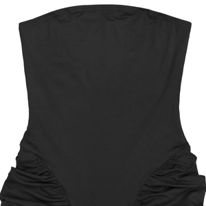 Detail of ruched sides on a black strapless tube top with slimming elastic fabric texture