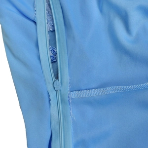 Detail of light blue mesh dress featuring a hidden KCC zipper and smooth inner lining