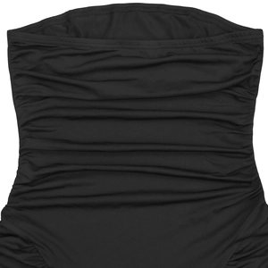 Detail of the black ruched elastic fabric and horizontal pleats on the bodycon dress
