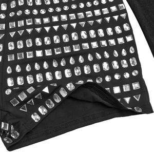 Macro detail of sparkling crystal rhinestones on black elastic knit bodysuit fabric