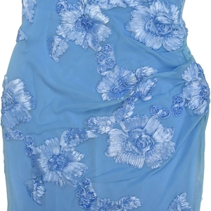Detail of light blue mesh dress featuring delicate 3D floral appliques and lace textures