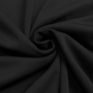Macro d'une texture de tissu noir élastique élégant avec des plis drapés doux