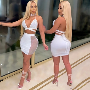 Detailed front and back views of white two-piece set with mesh side panels and rhinestones