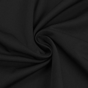 Vue macro d'un tissu en maille noir de qualité montrant la texture douce et les détails