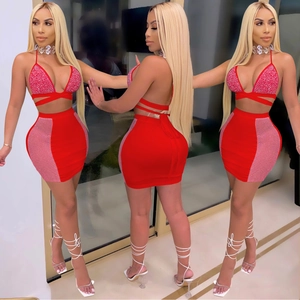 Sexy red two-piece party set with rhinestone halter top and side mesh mini skirt