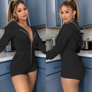 Front and back views of a black zip-up hooded romper with an elastic waist and long sleeves