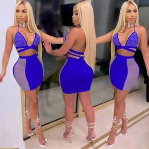Detail of blue two-piece set featuring rhinestone halter top and side mesh mini skirt