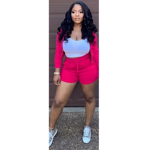 Detail view of women's fuchsia velvet 3-piece set with hoodie, shorts and white tank top