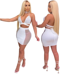 White two-piece set with rhinestones, halter neck top and mesh mini skirt detail