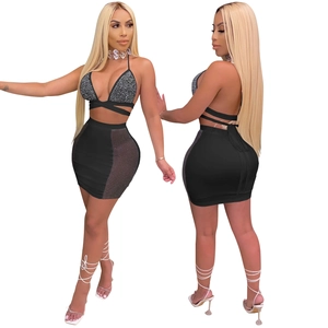 Detail showing backless rhinestone halter top and mesh panel mini skirt set