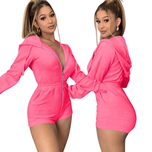 Detail view of pink velvet hooded playsuit with front zipper and elastic waist