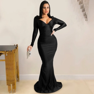 Detailed close-up of a long-sleeved black mermaid gown featuring a deep V-neck and silk-like sheen
