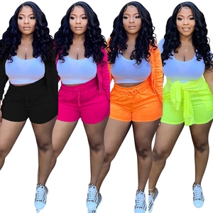 Detailed collage of women's three-piece tracksuit in four vibrant colors on plain background