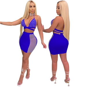 Blue sequin two-piece party set featuring halter top and mesh side mini skirt